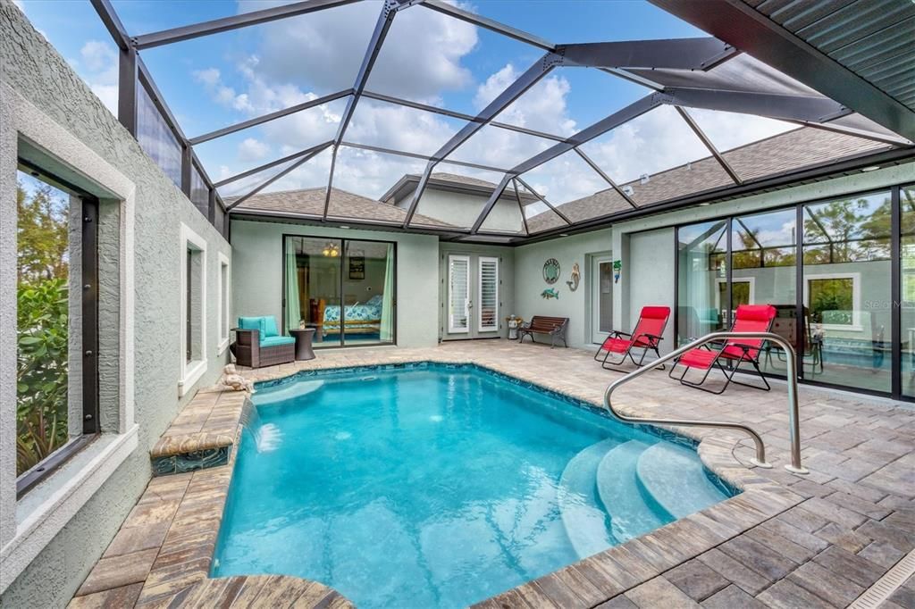 Pool courtyard view to pool bathroom at 137 Wahoo Drive, Rotonda West FL 33947