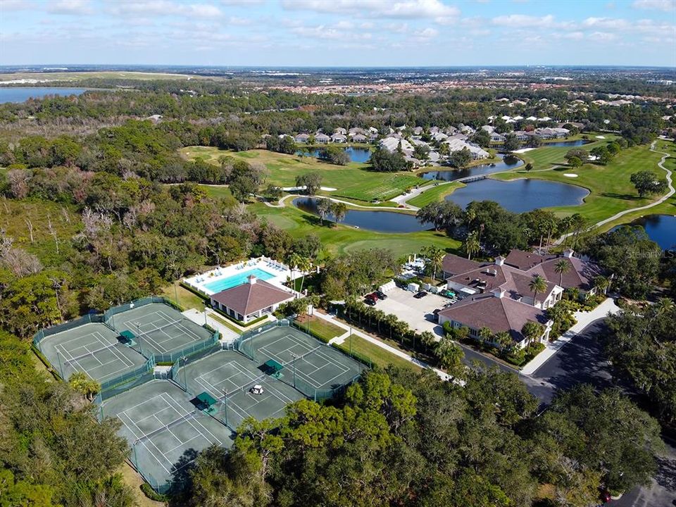 Overhead view of clubhouse, pool and tennis courts