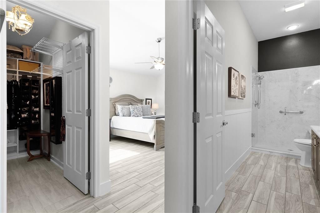 En-suite Bath with a Shower and Bench, Linen closet, a Custom Walk-in Closet