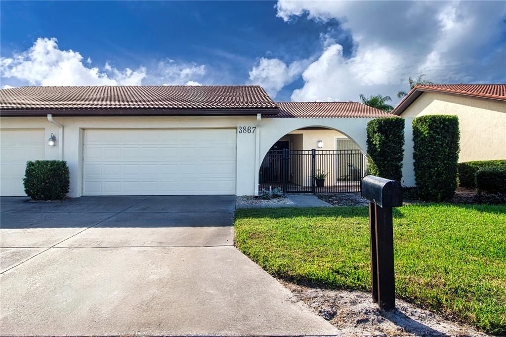 End unit villa, 2 car garage.