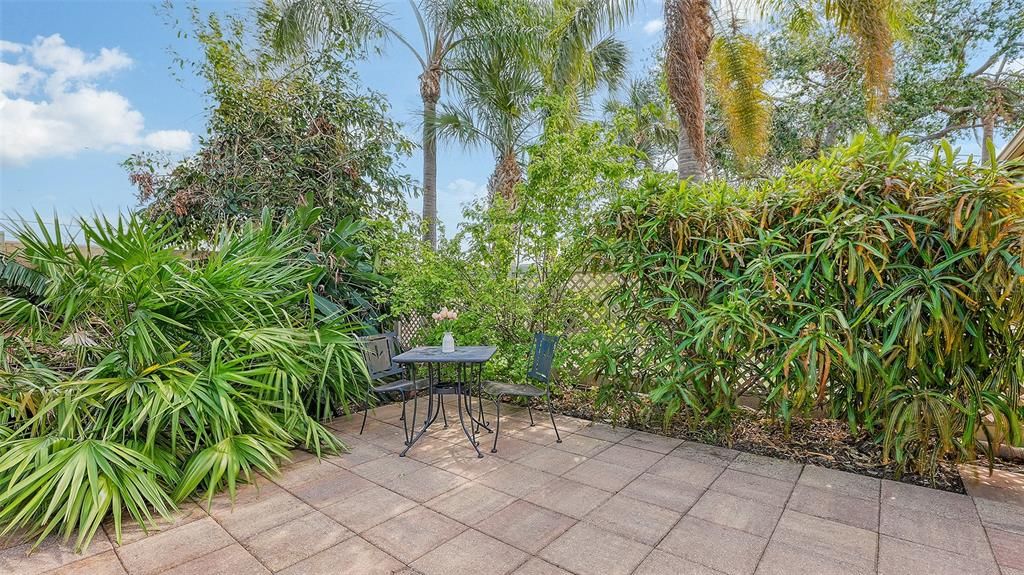 Patio off the kitchen is convenient for alfresco dining.