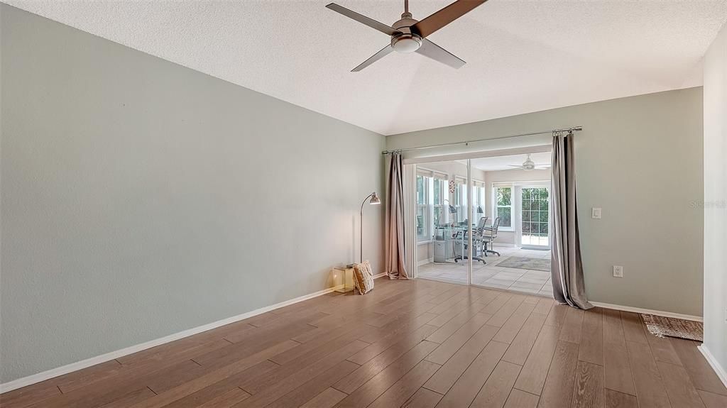 The Primary bedroom opens up to the enclosed lani.