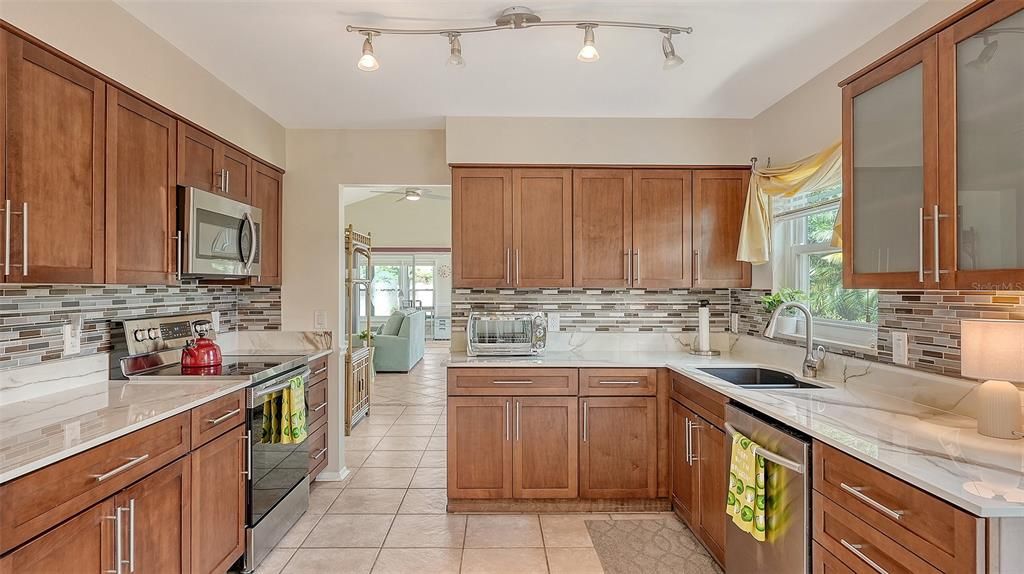 The custom kitchen is complete with soft closing drawers and cabinets... make sure you open them up to see what great storage capacity they have!