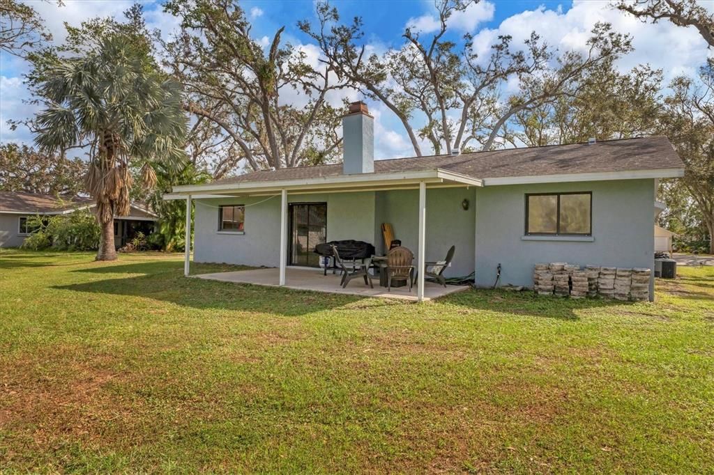 Rear of home with large yard