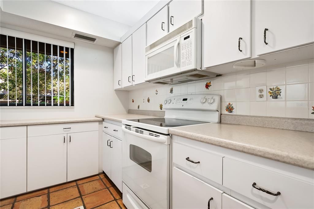 Kitchen with a view to the front treed area