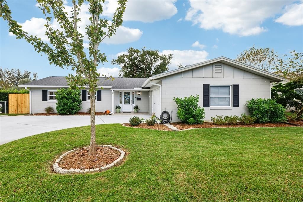 Dover Shores BLOCK HOME with NO HOA and a BRAND NEW A/C (2024), FRESH INTERIOR PAINT (2024), NEW GARAGE DOOR (2021), NEW ROOF (2019), NEWER KITCHEN APPLIANCES (2019), and UPDATED FLOORING + a NEW WATER HEATER (2018)!