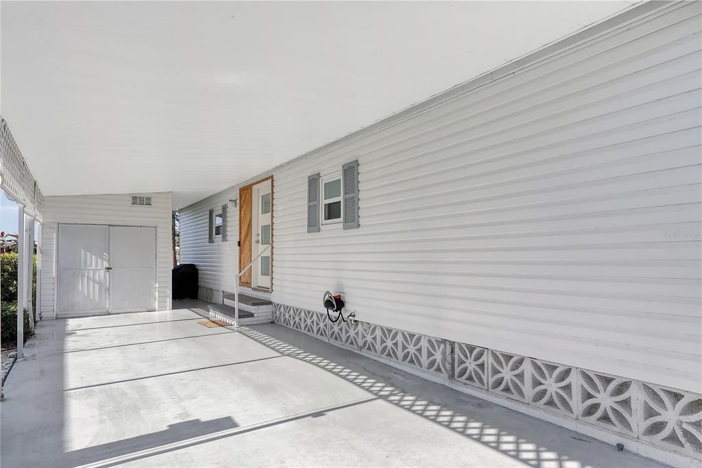 carport with utility shed