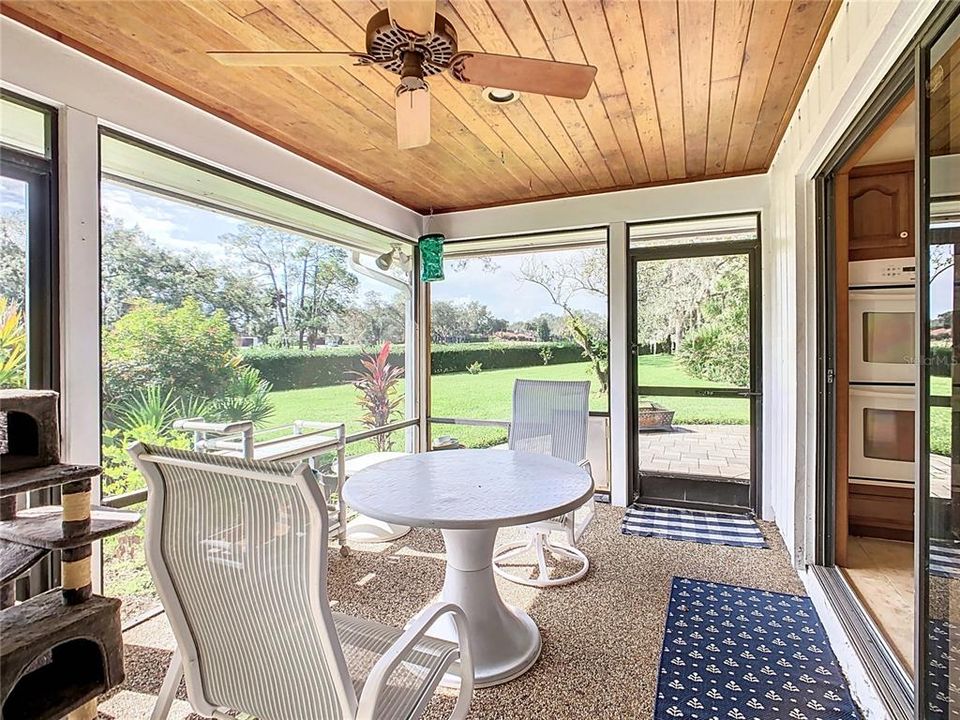 SCREENED-IN LANAI OVERLOOKING PAVER PATIO