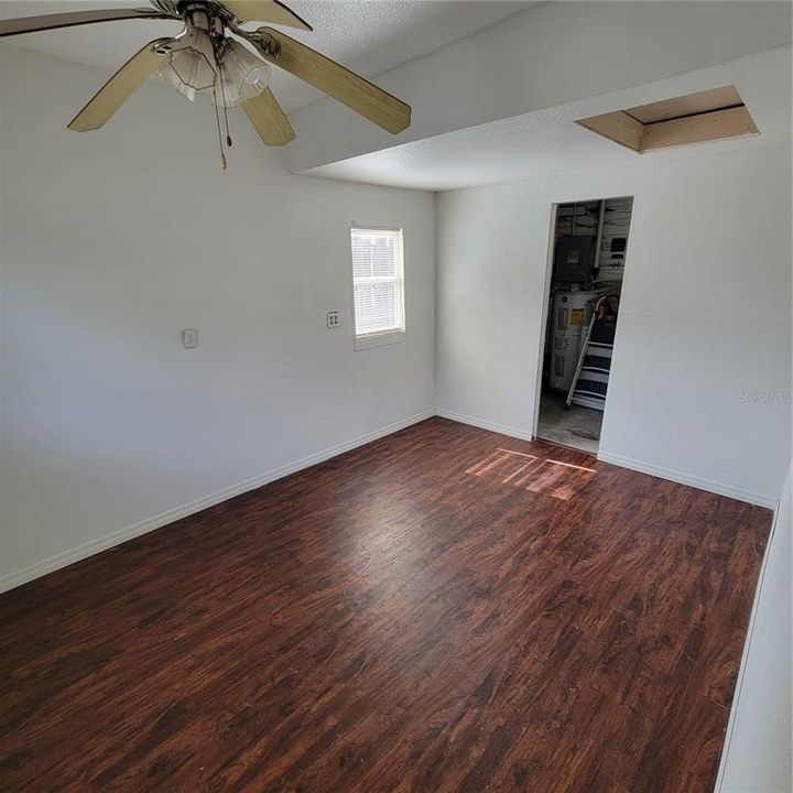 Laundry and storage in the back of this room