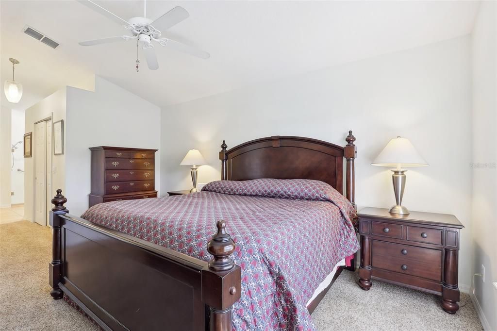 Primary bedroom with ensuite bathroom and two closets