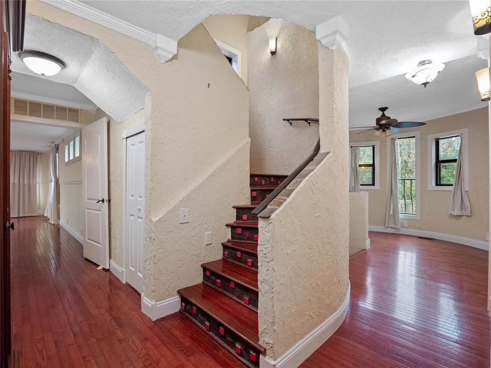 Stairs to 3rd floor with entrance to primary bedroom to the left.