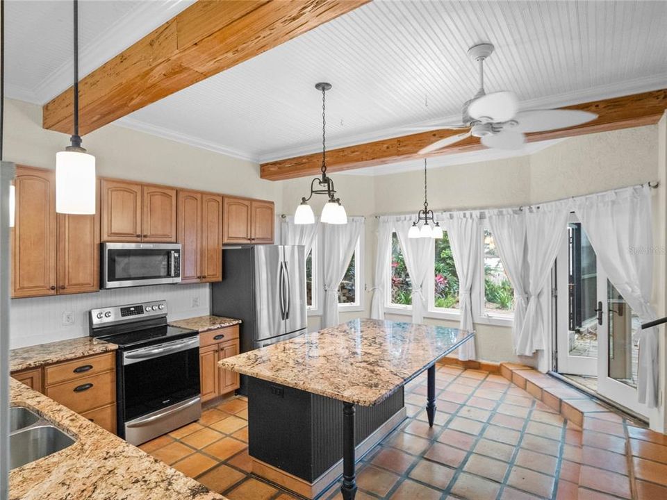 Kitchen with lake and pool views