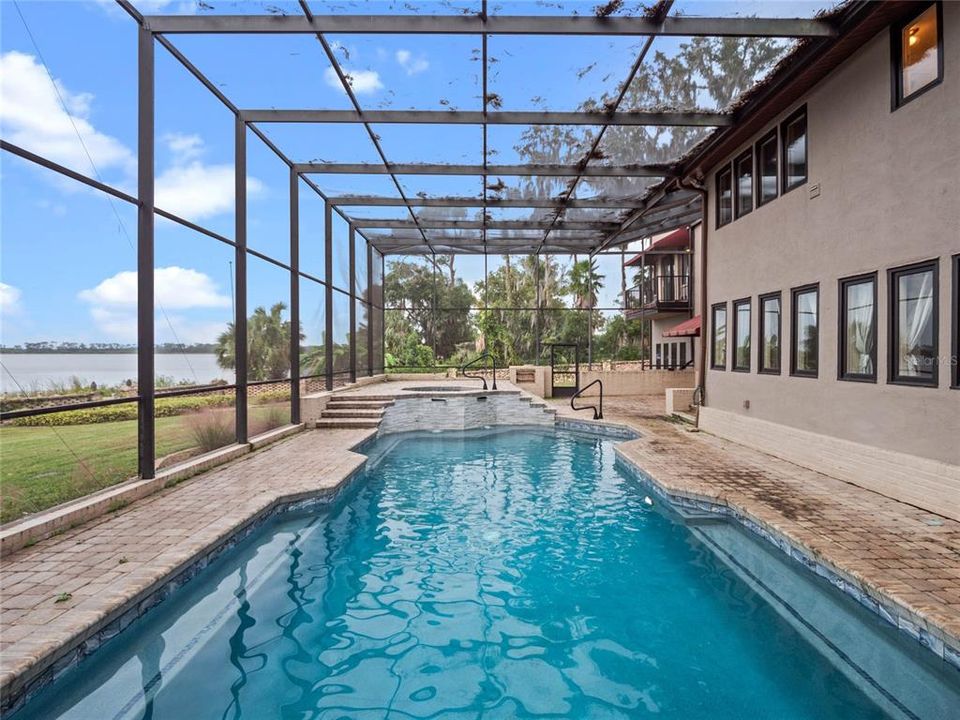 Pool with hot-tub and sunset views of the lake