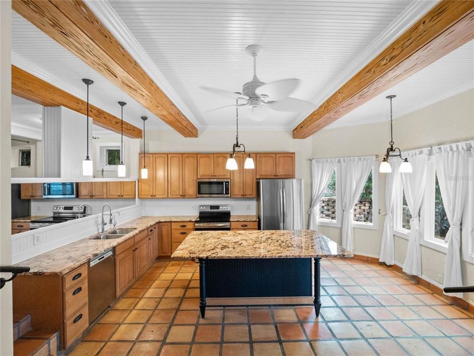 Kitchen with lake and pool views