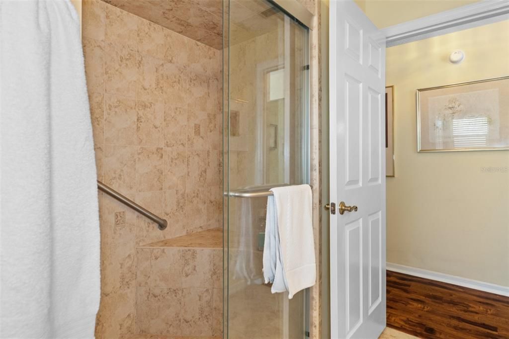 You'll love the frameless shower doors and built-in shower seat.