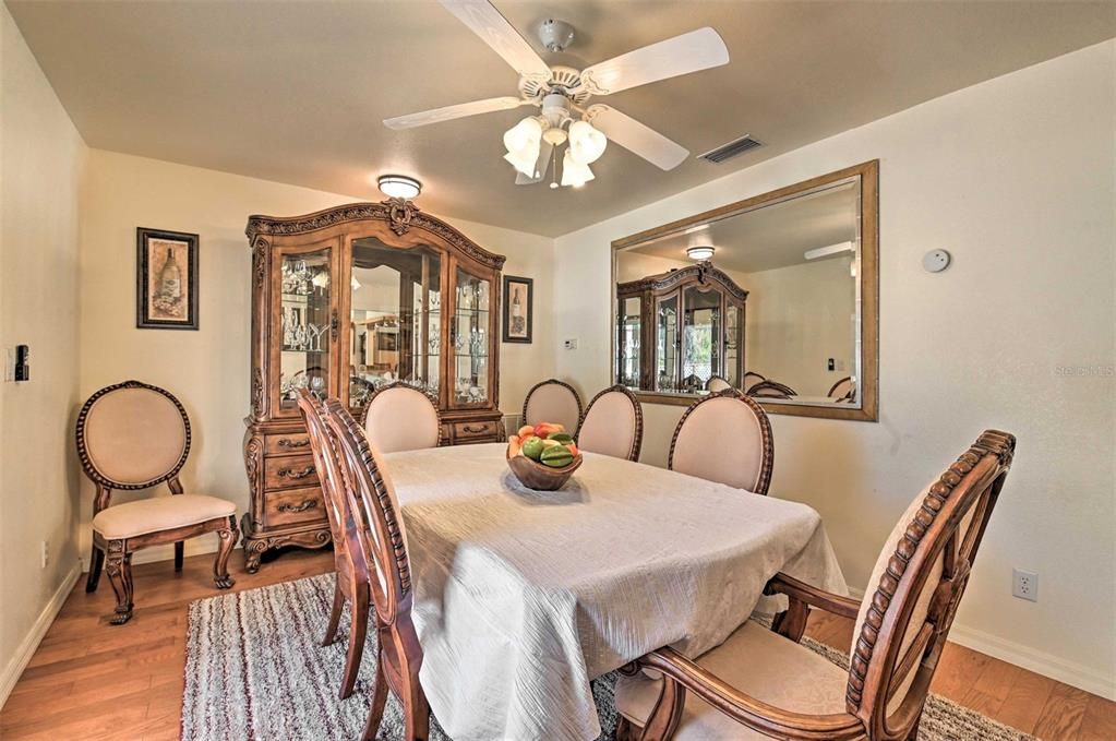 Formal dining room w/french doors that open to back deck pool area