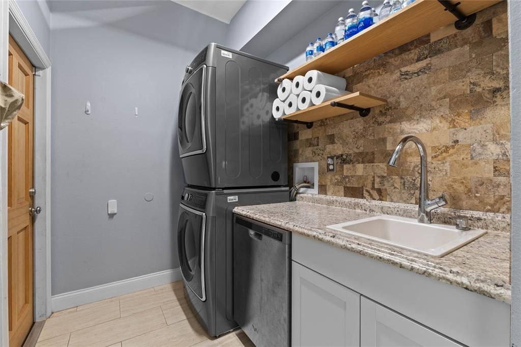 Oversized laundry with second dishwasher and storage