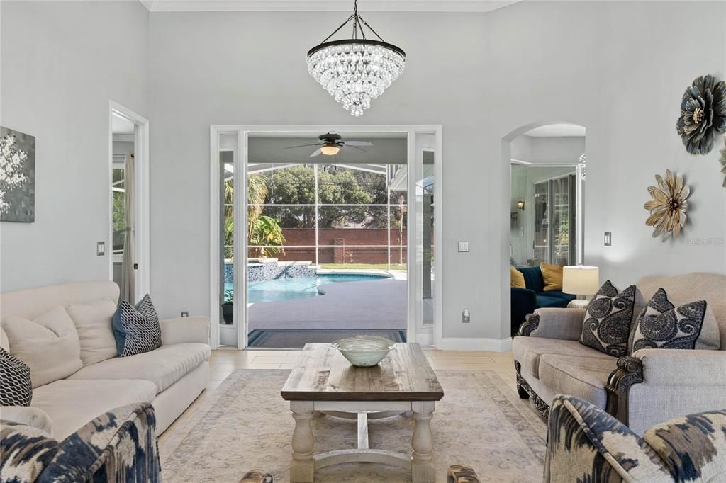 Formal living room open to pool and outdoor area