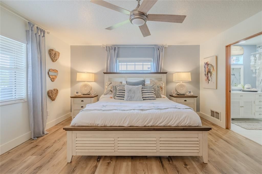 Primary bedroom with view of pool