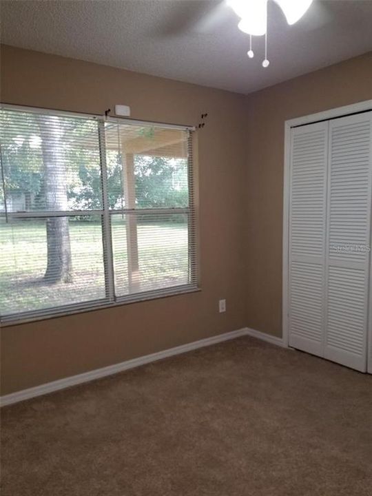 Bedroom 2 - Big closet and view of back yard