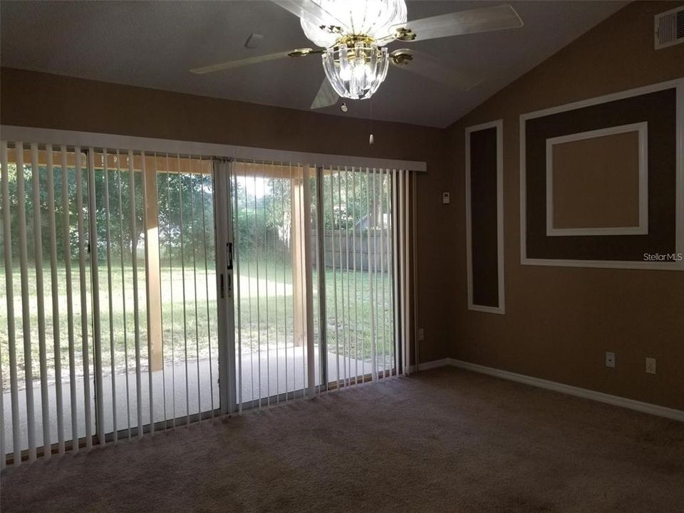 Family Room, with views of the back porch and yard.