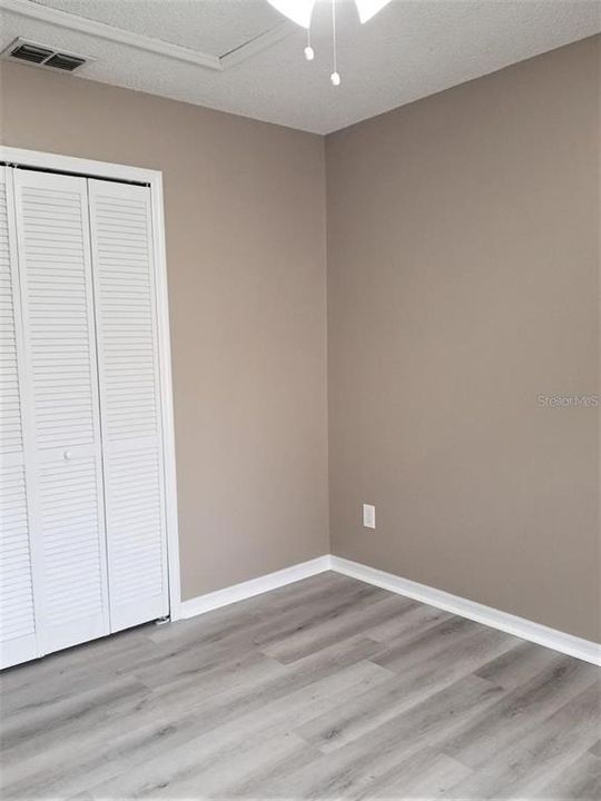 Bedroom 3 - great sized closet, New Flooring and fan/light!