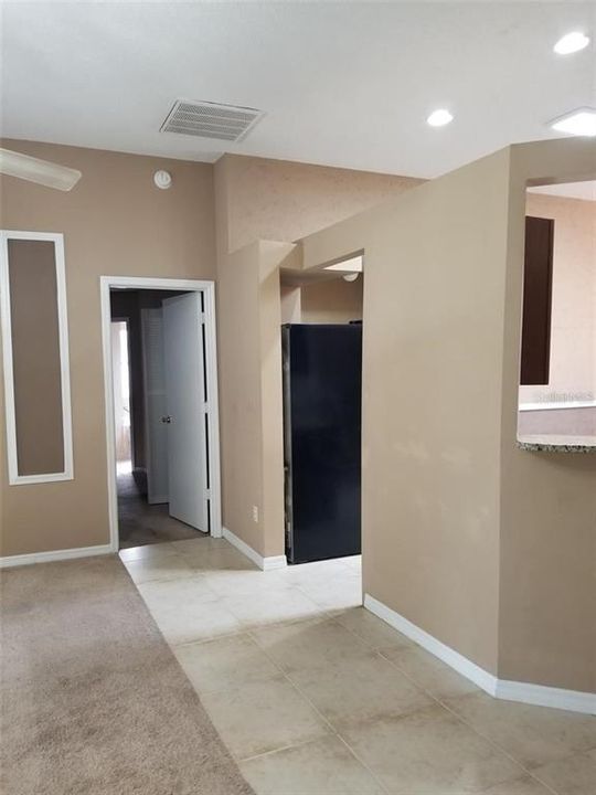 Walkway into Primary bedroom , with Family Rm to Left, and Kitchen to right