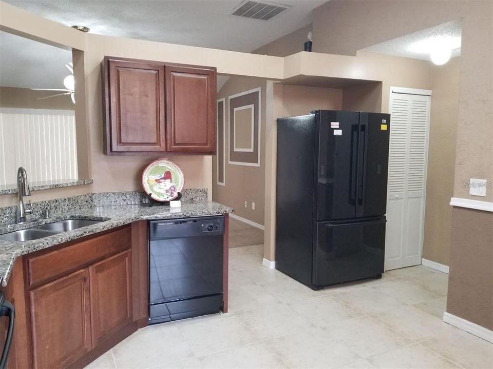 Your kitchen - Granite counters, wood cabinets, refridge, dishwasher, stove and microwave