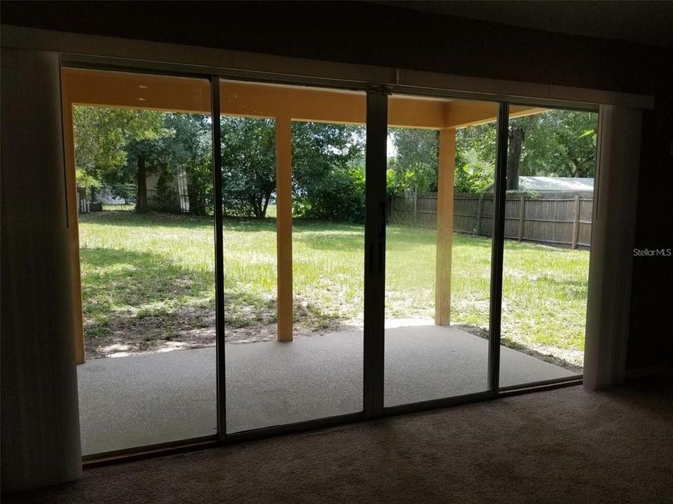 View of backyard & covered porch from your Family Room