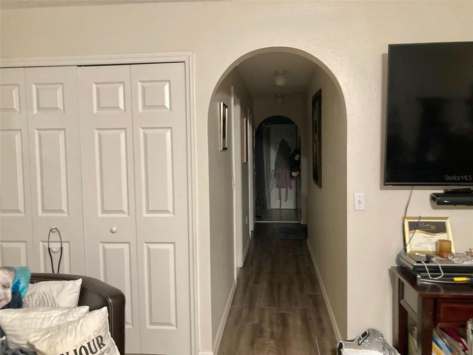 MASTER BEDROOM WALK IN CLOSET AND TO BATHROOM