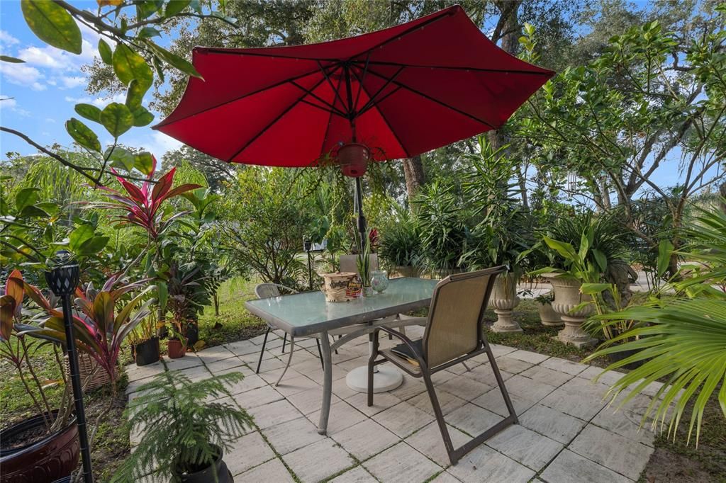 PATIO AREA SURROUNDED BY FRUIT TREES.