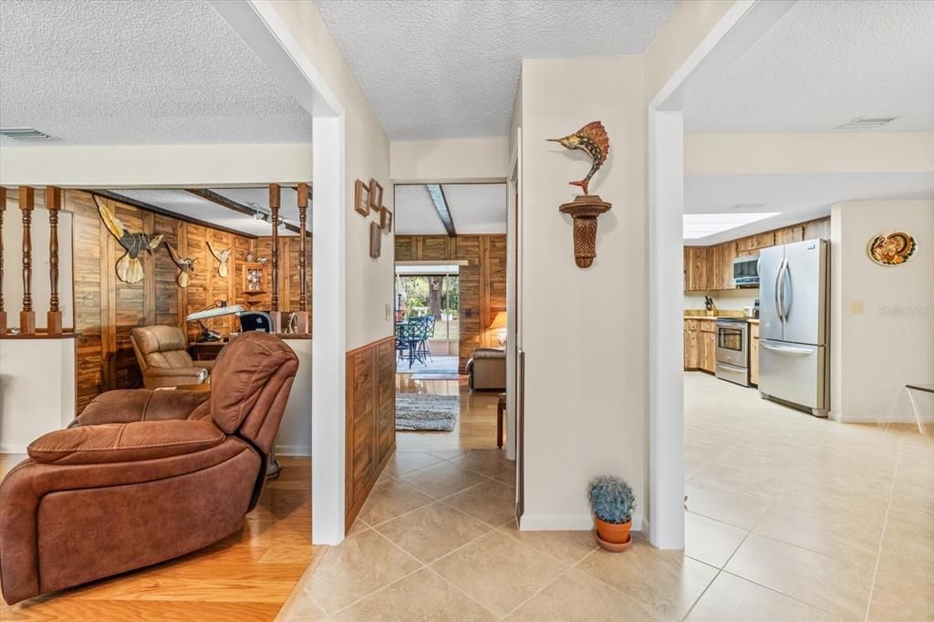 Tiled Foyer...View From Front Door..Formal Living on Left, Kitchen & Family Room Ahead & Dining Room on Right