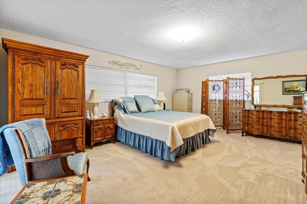 Master Bedroom w/ Slider to the Lanai, 2 Walk in Closets & Ensuite w/ Tiled Shower