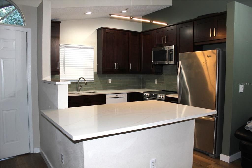 Renovated kitchen with Quarts counter-tops