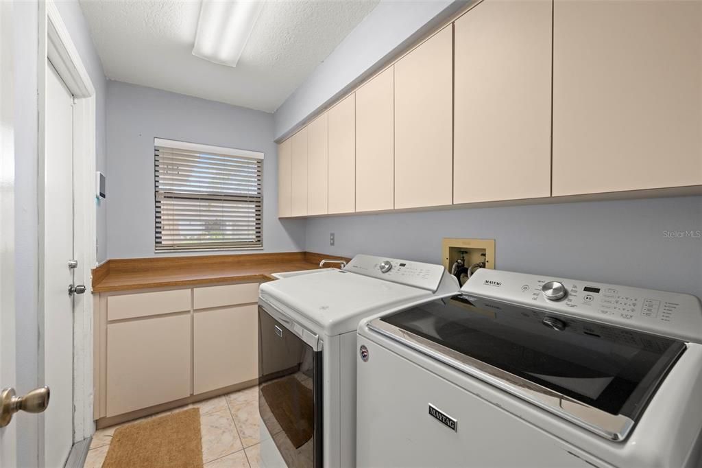 Laundry Room + Plenty of Cabinetry/Storage + Mud Sink