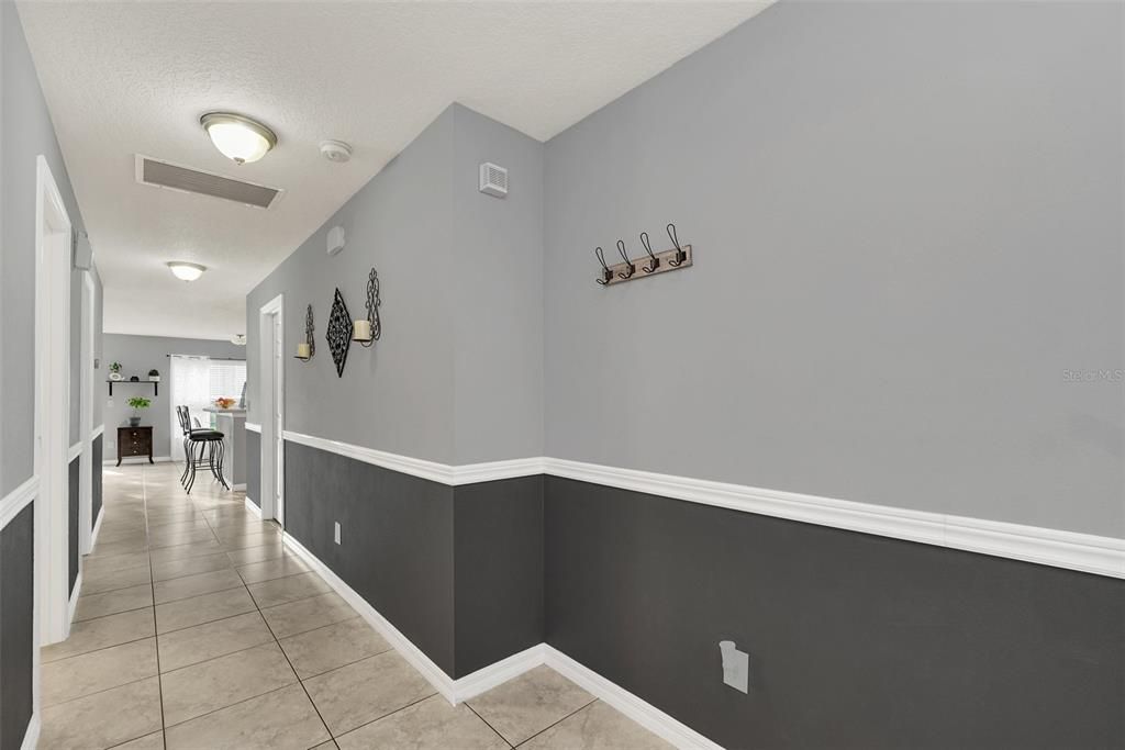 Entrance HallwayBedrooms and Bathroom are on the left. Laundry Room and Garage on the right