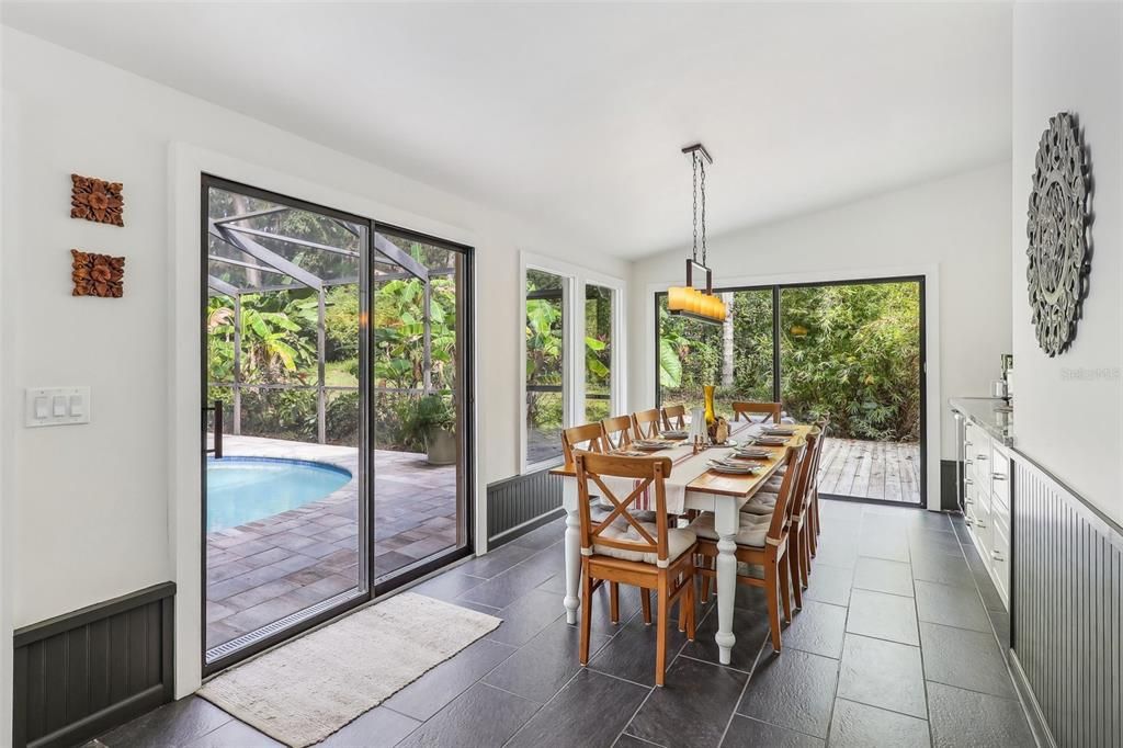 Florida Room full of Light.  Currently used as the Dining Area