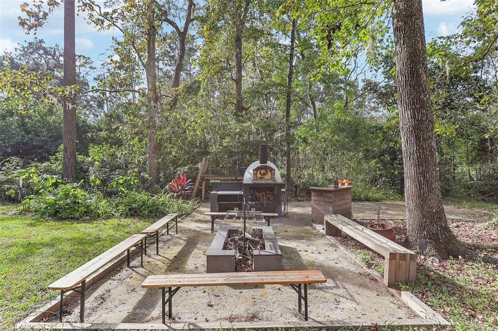 Outdoor kitchen with pizza oven, Brazilian grill will running water!