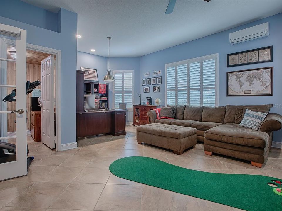 WOW!  WHAT A ROOM! PLANTATION SHUTTERS AND A MINI-SPLIT.  A SAFE ROOM TO THE LEFT.