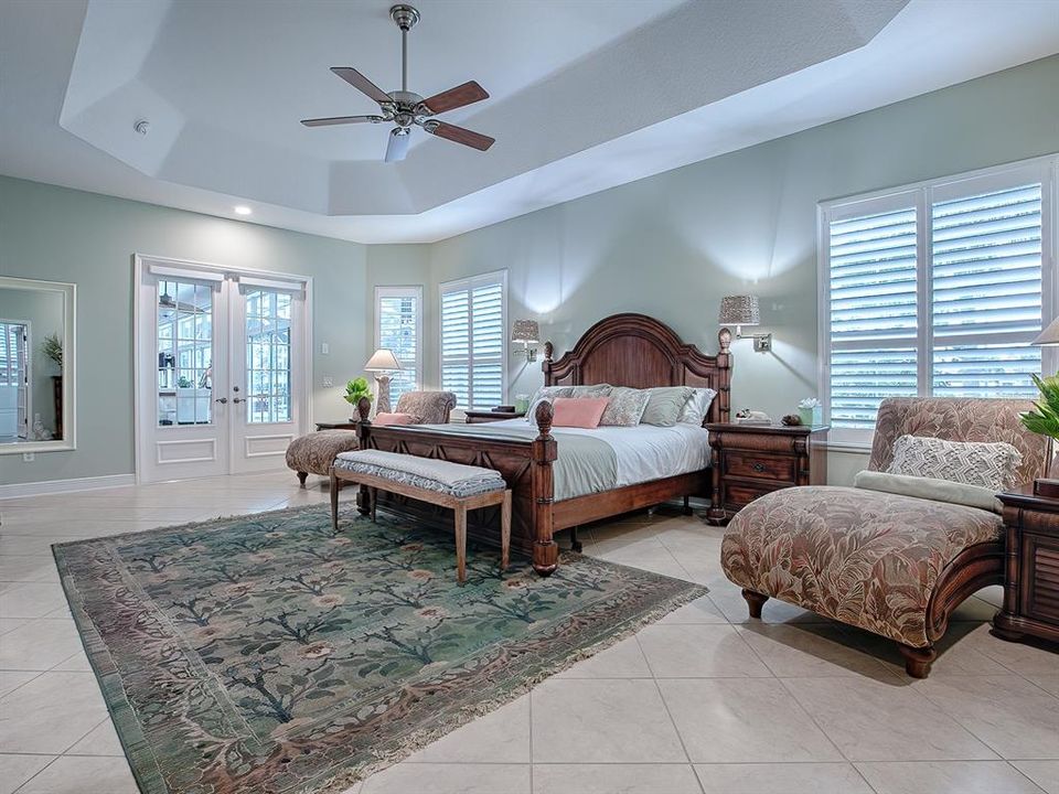 THE FRENCH DOORS OPEN OUT TO THE FLORIDA ROOM AND POOL.