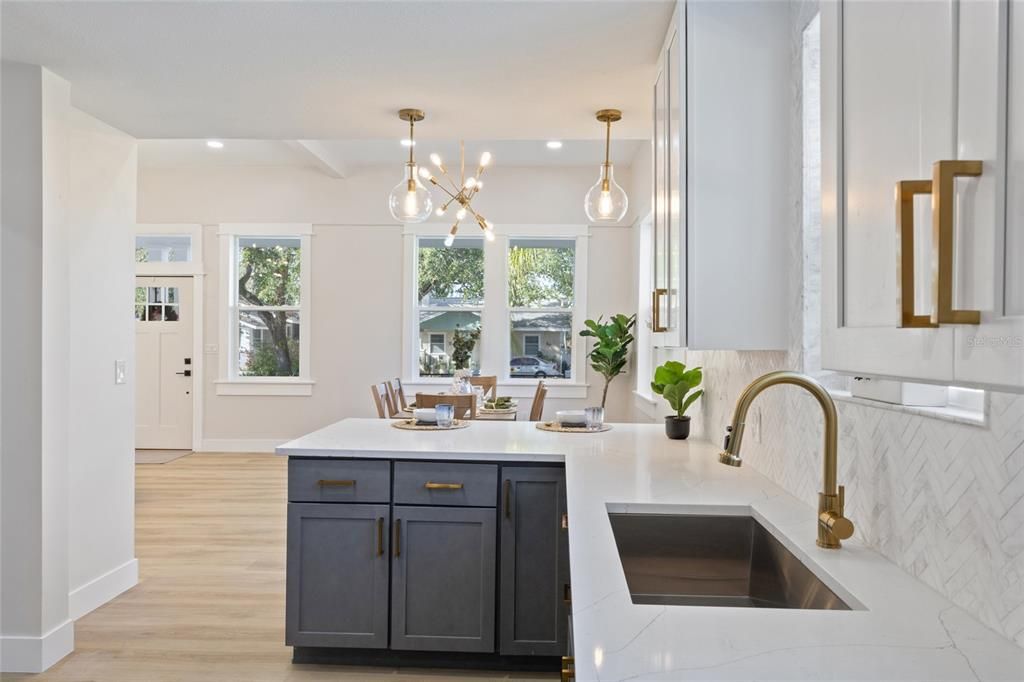 This kitchen has it all new appliances, fresh paint, new flooring, &  new cabinets with gold hardware