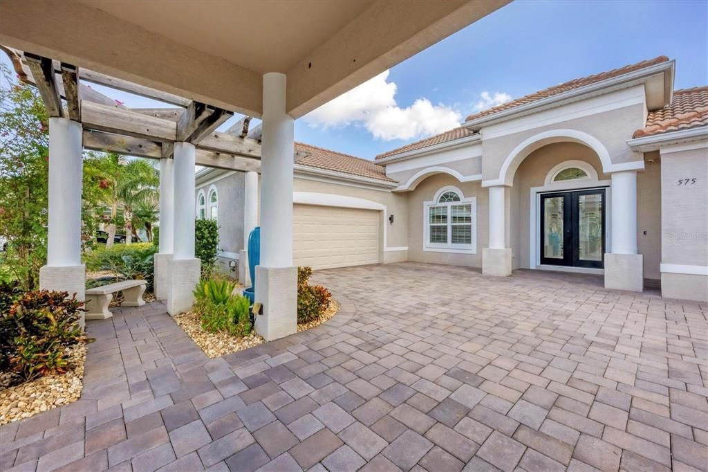 There's no place like home- peaceful bubbler under the sun-shielding Pergola is so inviting!