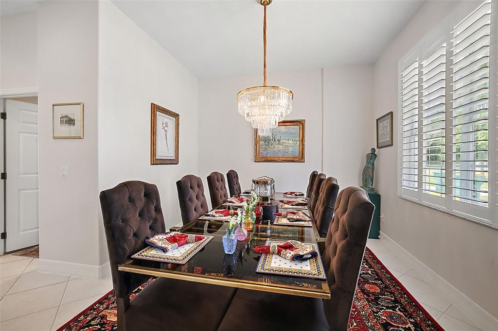 Formal Dining with Savannah shutters views the front fountain.