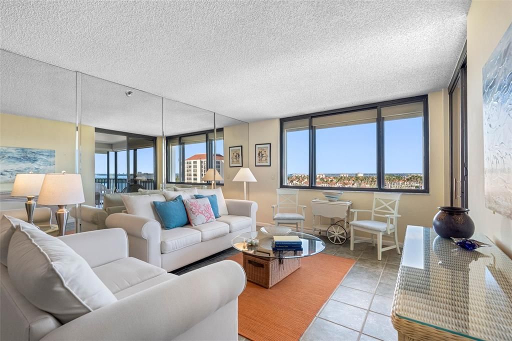 Light-filled and spacious, this living room offers unmatched views of Lake Bahia, Boca Ciega Bay and Downtown St. Pete.