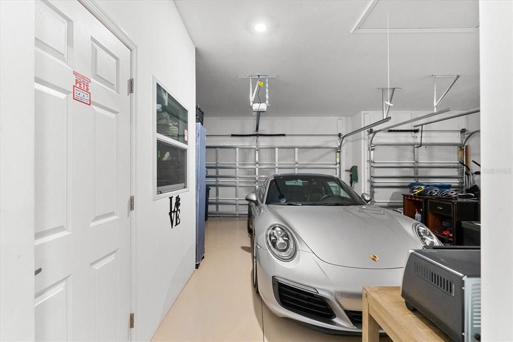 3 Car Garage.  Added AC'd area for storage/dogs.