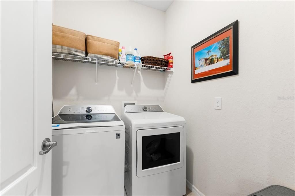 Laundry room with upgraded washer/dryer.