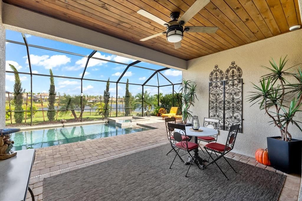 Lanai with renovated wood paneling on ceiling.