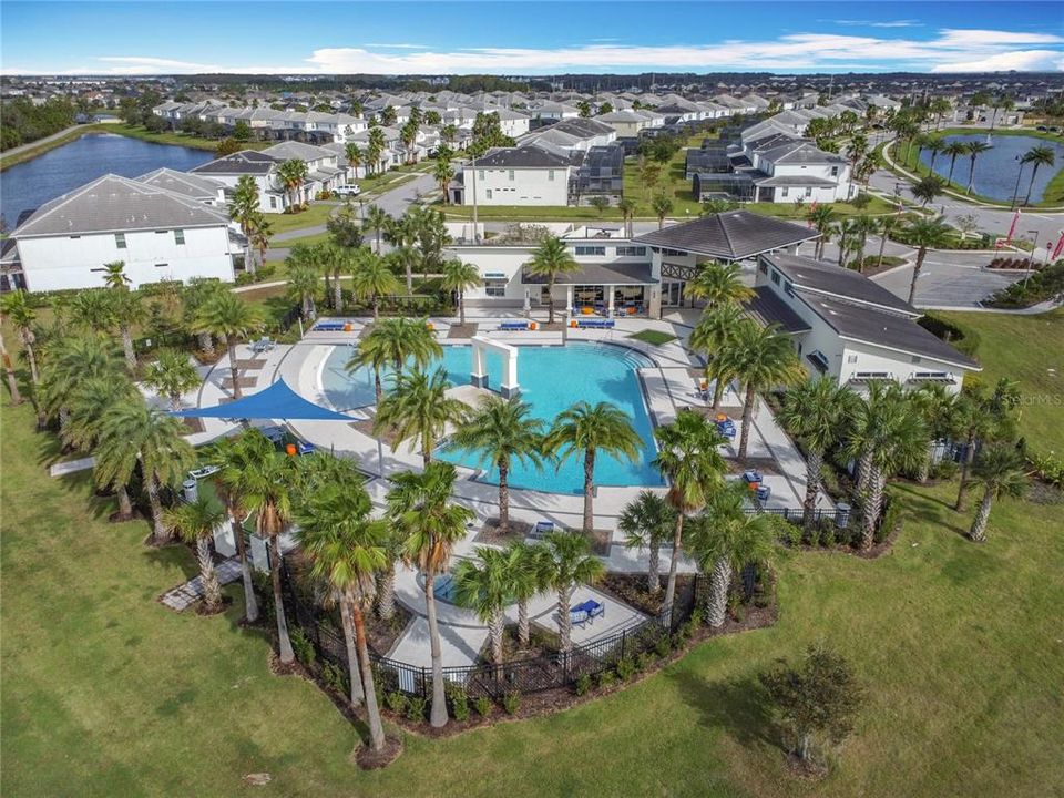 Community pool aerial view with lake view