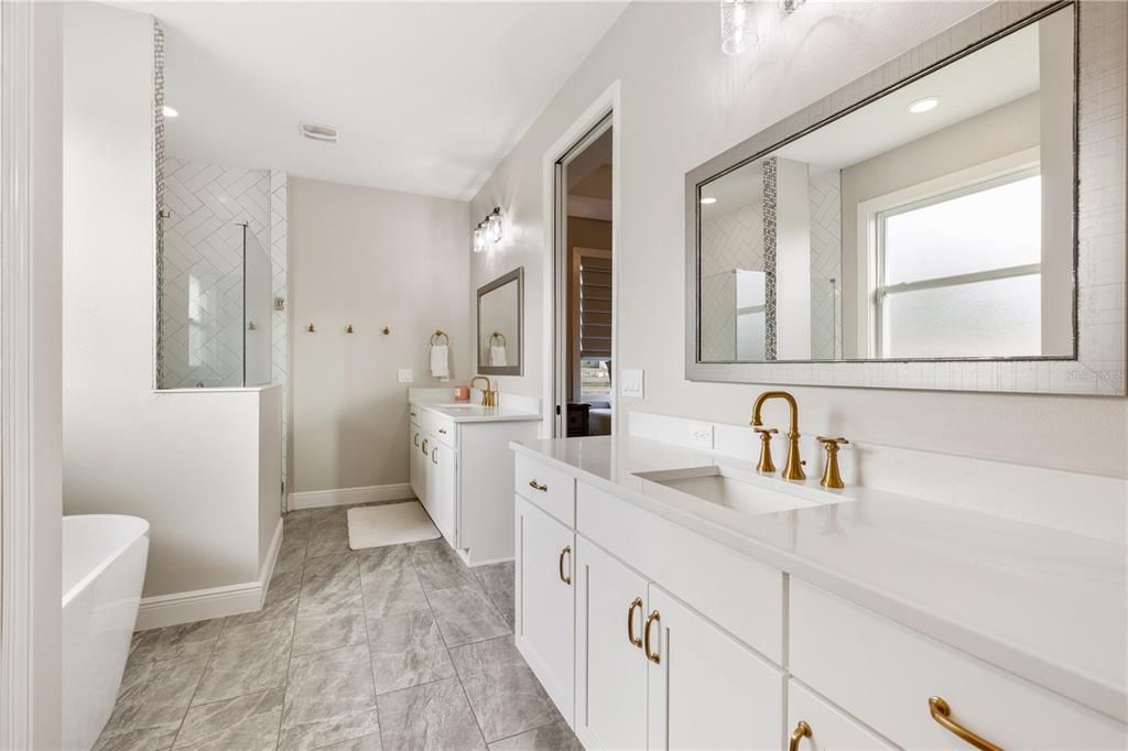 Master Bath w/double vanities, spacious walk-in shower w/bench & soaking tub