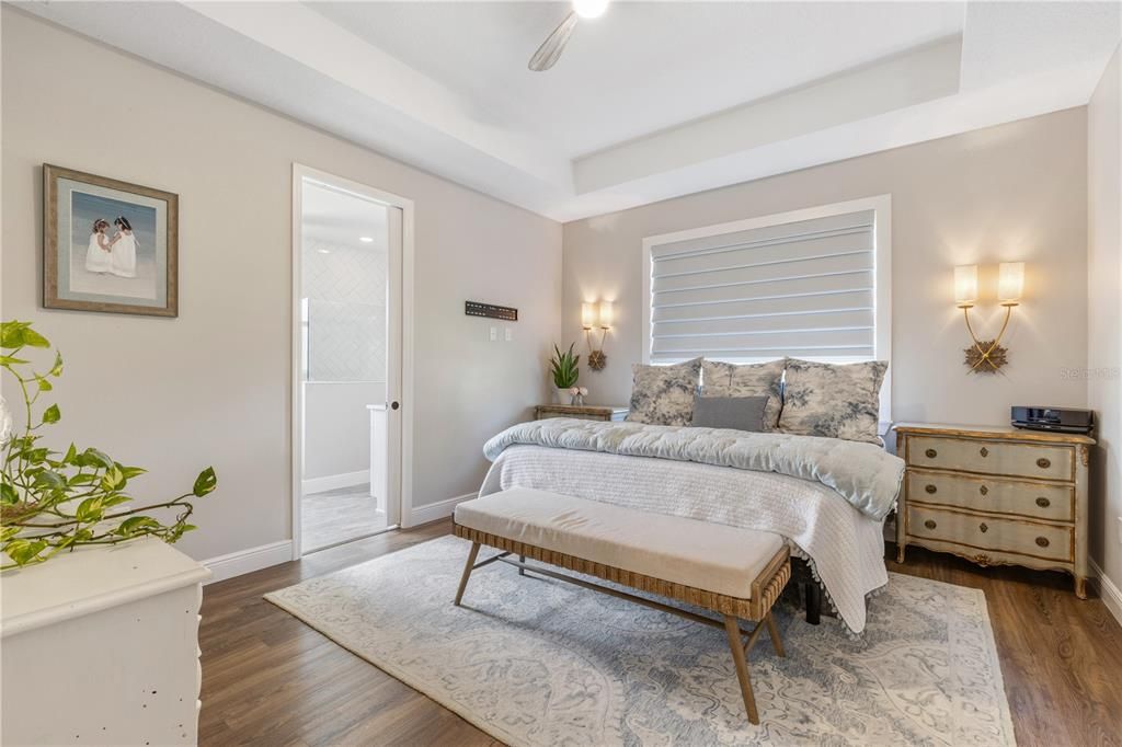 Master Bedroom w/Tray ceilings, & new ceiling fan & sconces.